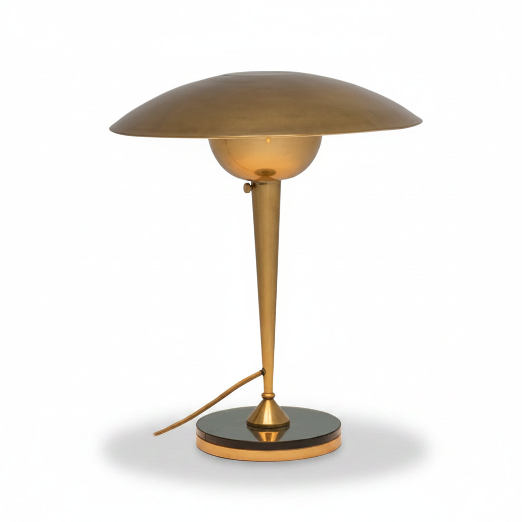 Brass table lamp with a white background