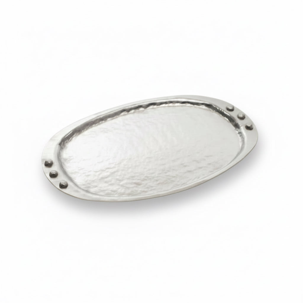 Decorative metal plate with a textured surface on a white background
