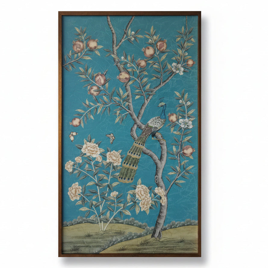 Decorative panel with a bird on a branch, flowers, and pomegranates against a blue background
