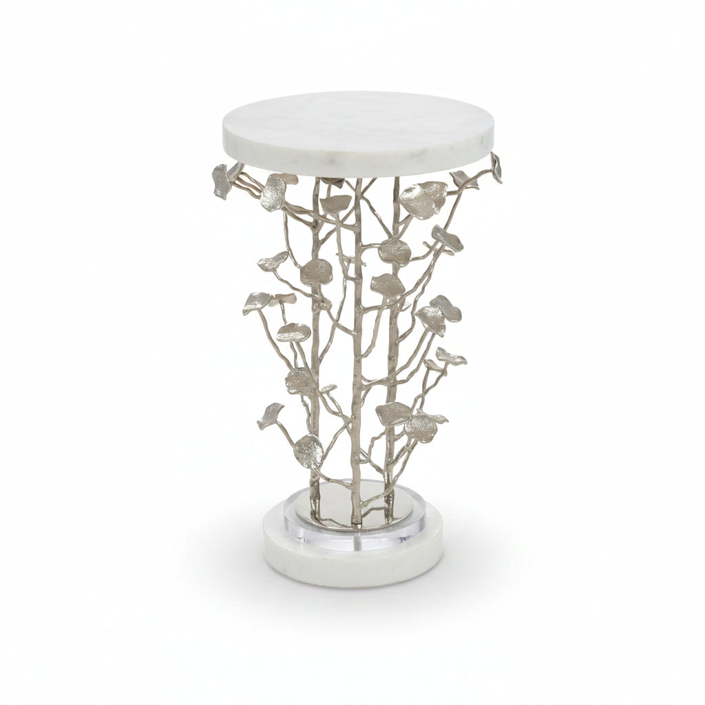 Decorative side table with white marble top and base, and silver branch-like structure.