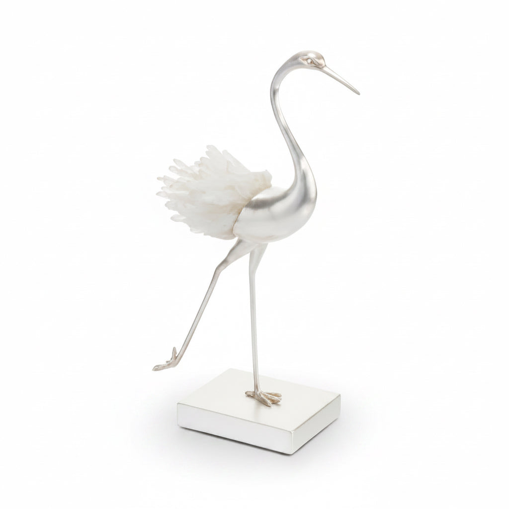 Decorative flamingo sculpture on a white background