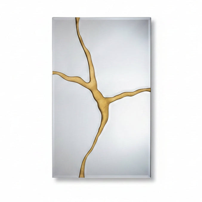 Decorative mirror with gold abstract design on a light gray background