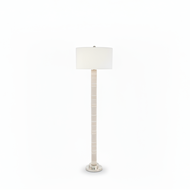 Floor lamp with a white shade on a white background