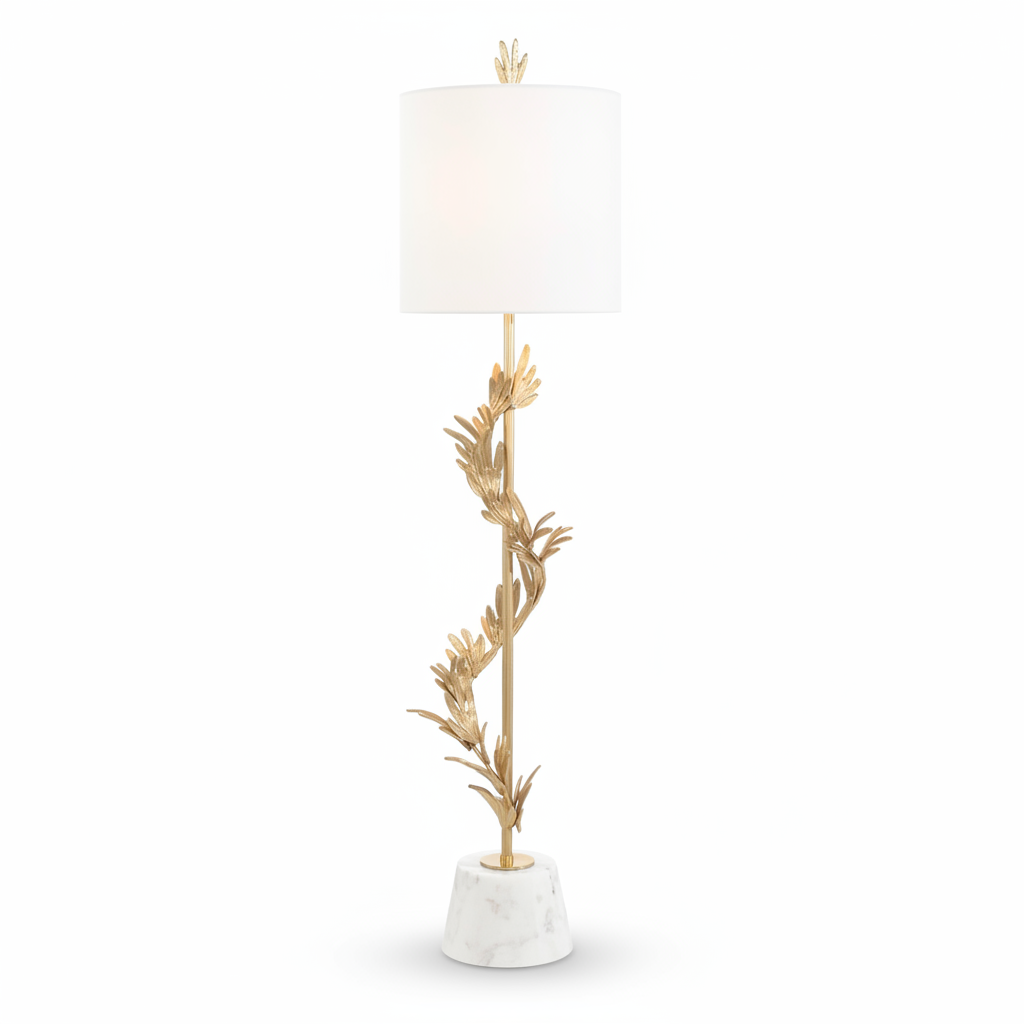 Decorative floor lamp with gold leaf design and white shade on a white background