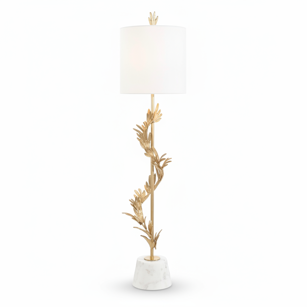 Decorative floor lamp with gold leaf design and white shade on a white background