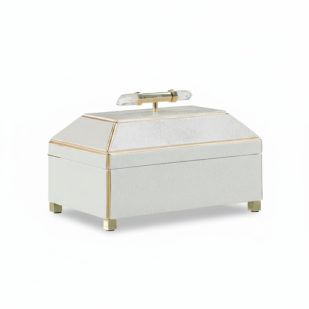Decorative jewelry box with gold accents on a white background
