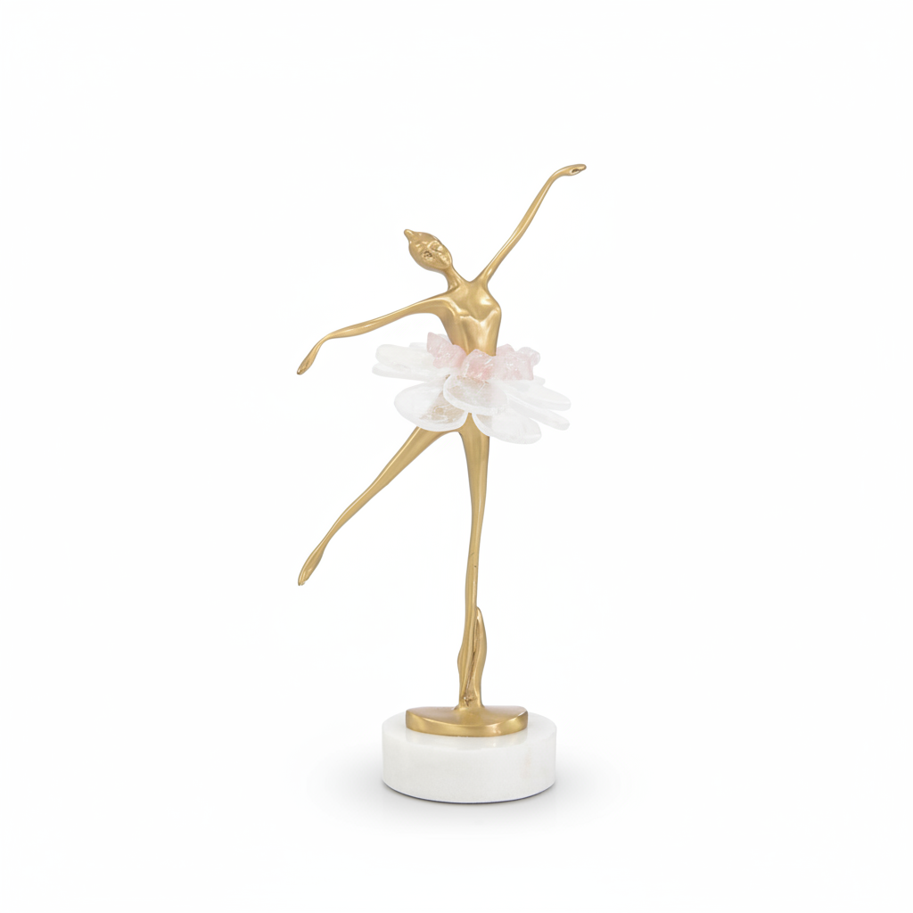 Gold dancer figurine with a white flower on a marble base against a white background