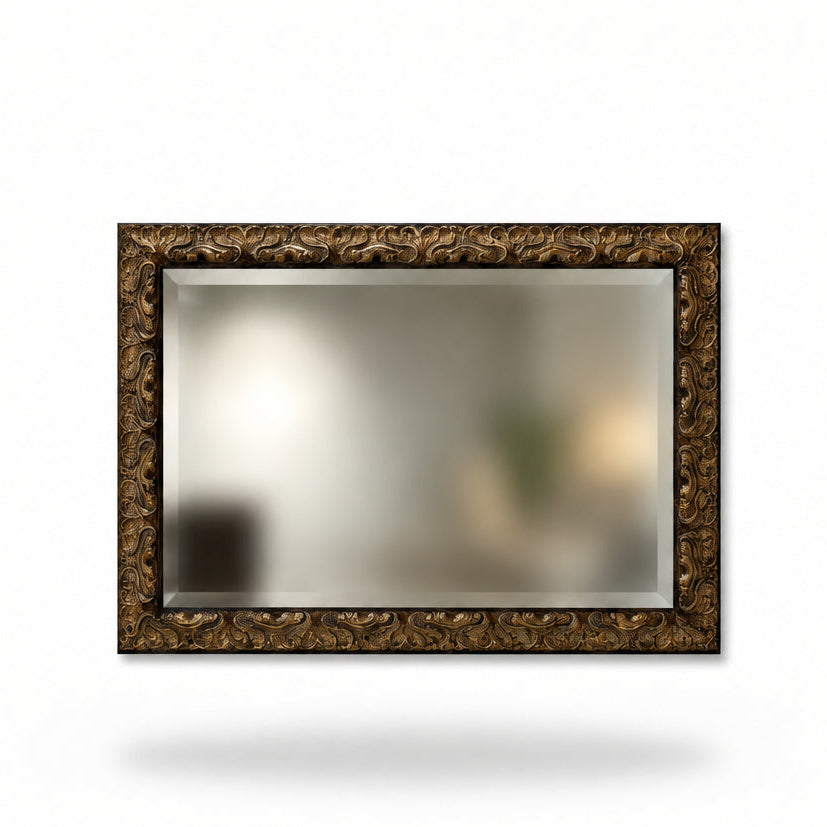 Large beveled mirror with decorative gold frame 
