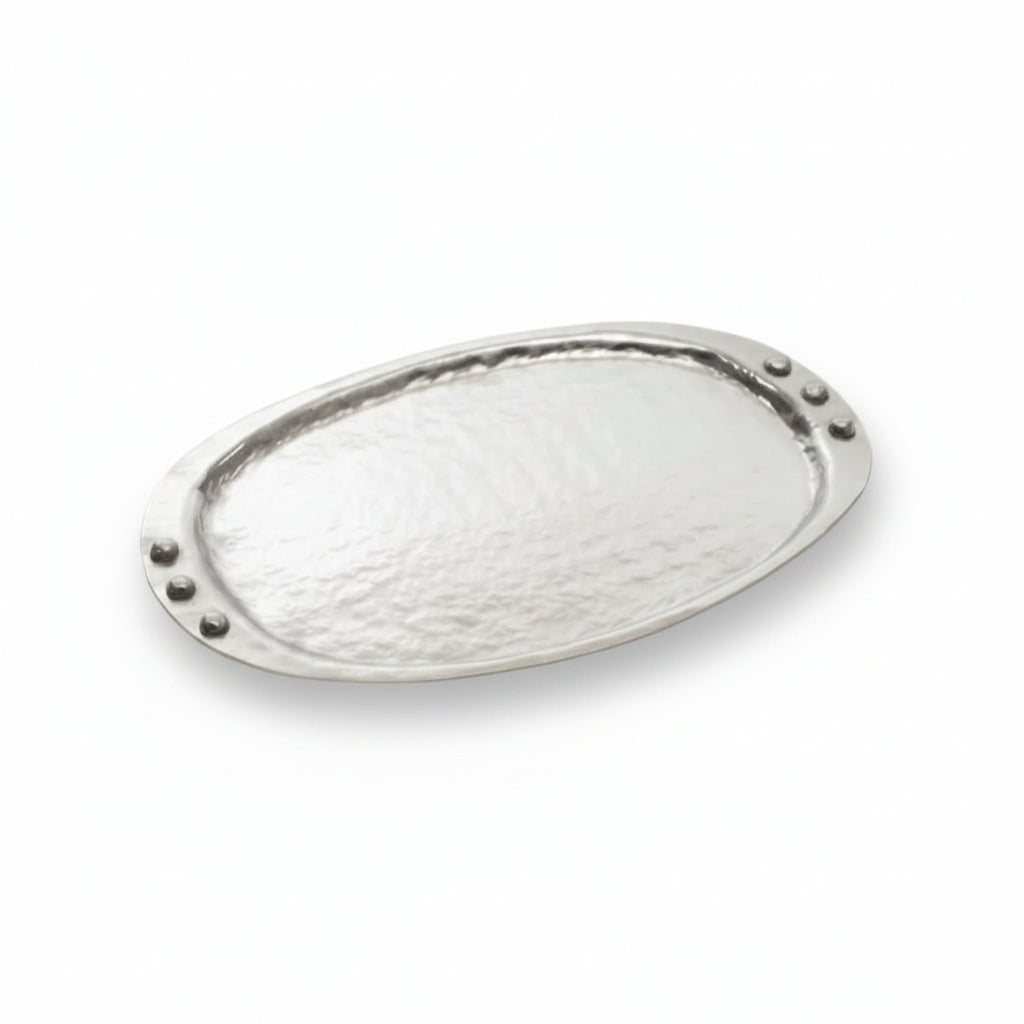 Decorative metal plate with a textured surface on a white background