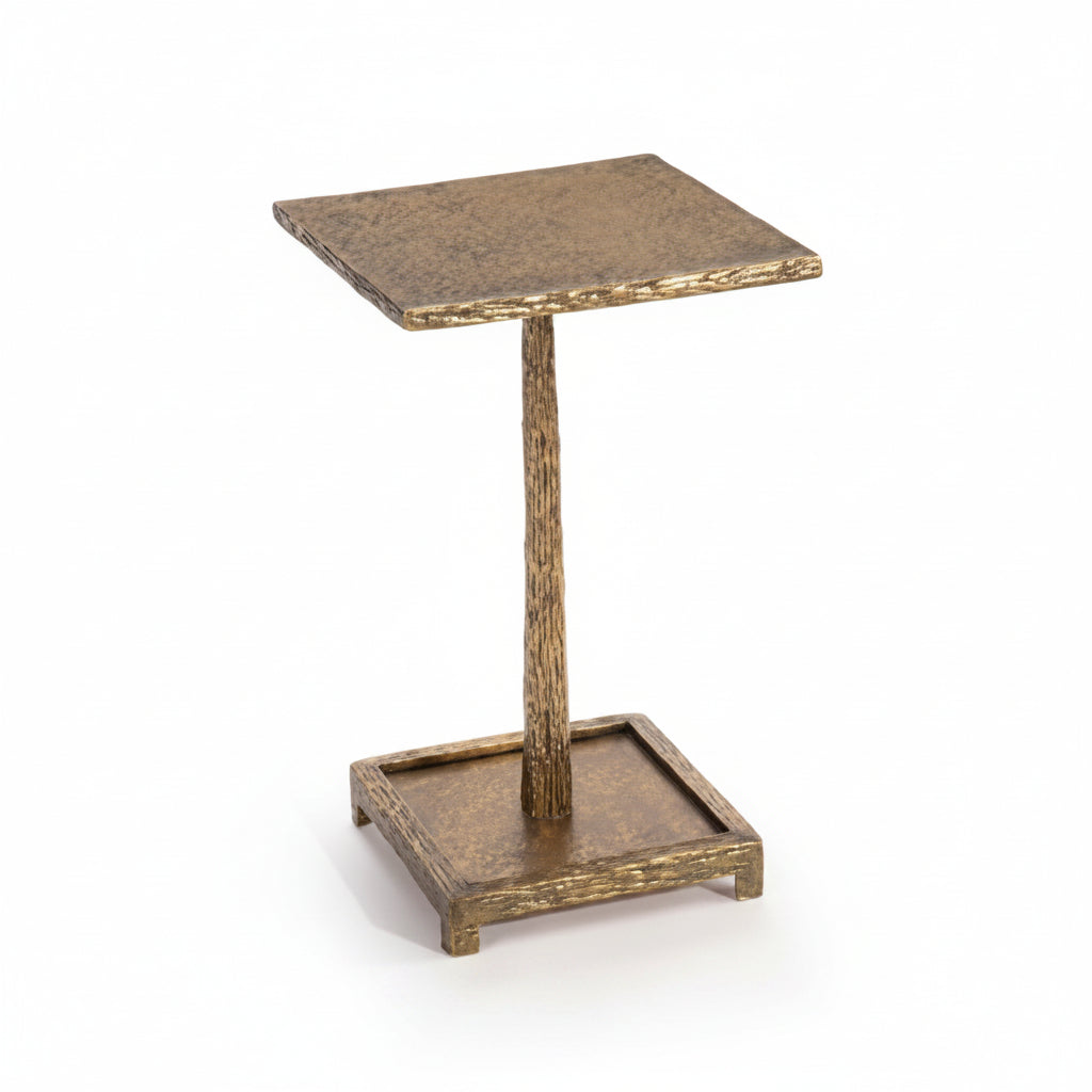aged gold side table on a white background