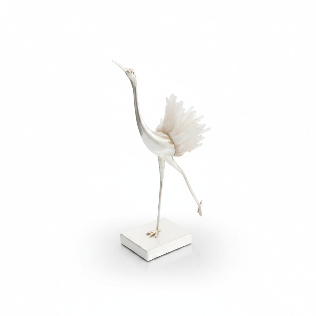 Decorative sculpture of a crane with a shell on a white background