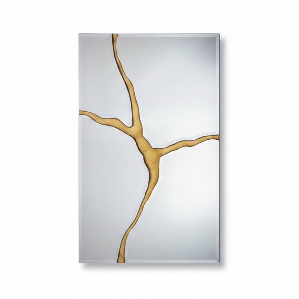 Decorative mirror with gold abstract design on a light gray background