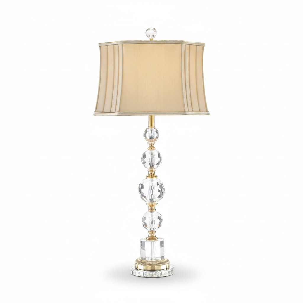 Decorative lamp with crystal base and beige shade on a white background