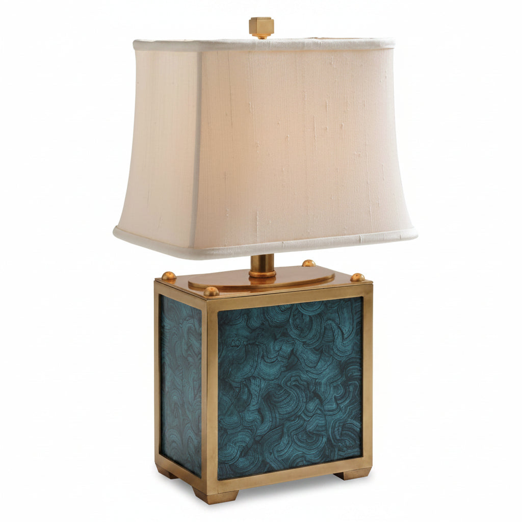 Table lamp with a decorative base and beige lampshade on a white background